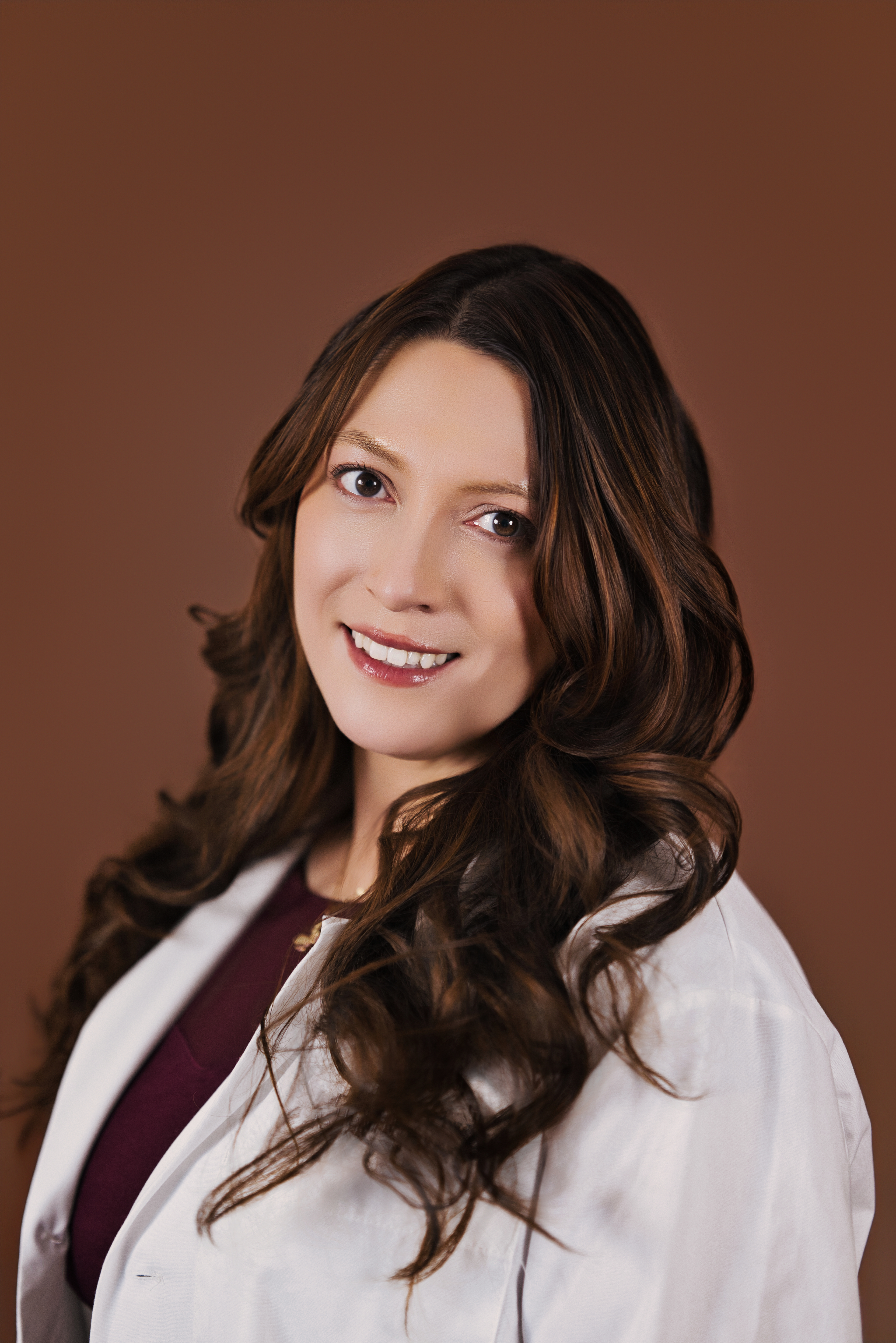Dr. Katya Alcaraz Voelker in white coat